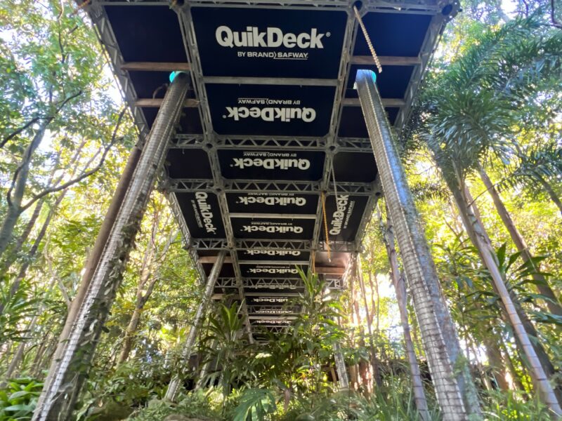 Looking up at QuikDeck suspended access platform installed beneath the footbridge in the rainforest.