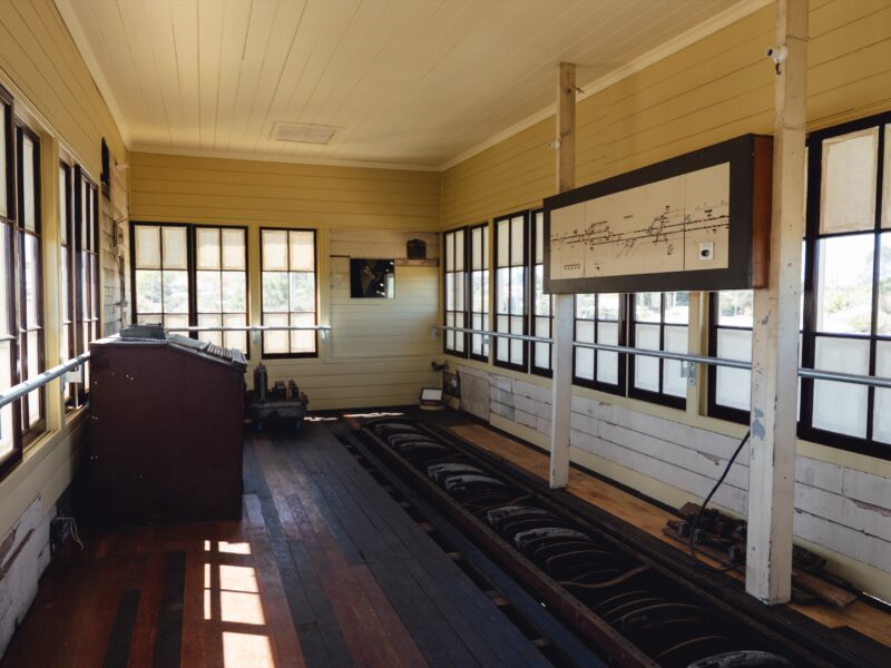 The restored operating room with timber floor, lever frame and track diagram, lit by banks of timber windows.