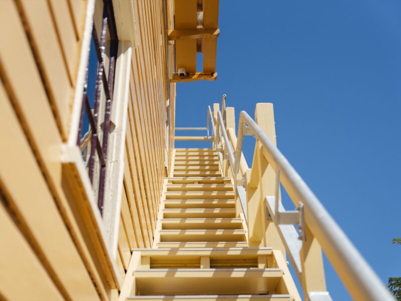 Looking up the restored external timber stair.