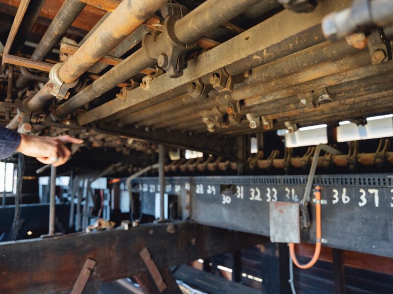 Signalling mechanism beneath the lever frame in the restored cabin.
